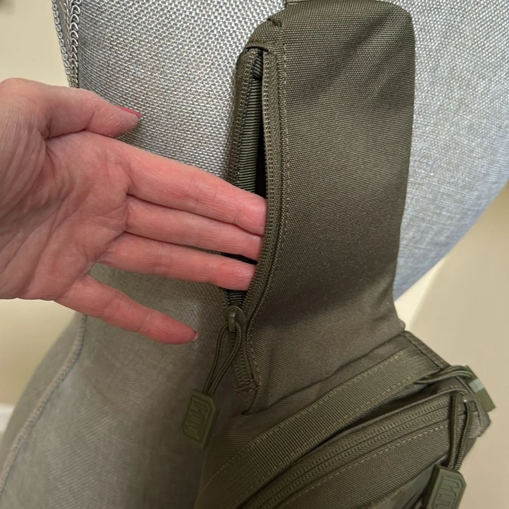 Tactical Sling Bag - Olive Green. Multiple pockets. Spacious compartments.